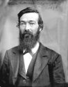 Studio photograph of Alonzo, with clear eyes and a long dark beard