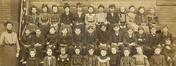 Closer view of class members and Miss Moneypenny