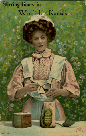 A sweet young lady stirring something in a small bowl; label: 'Stirring times in Winfield, Kansas'