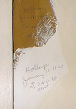 Original writing on dark wall; written again on white plaster surrounding this spot