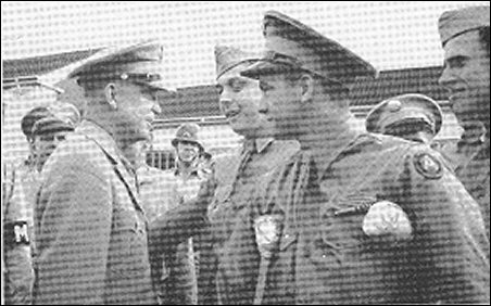 [Two photos of Eisenhower in uniform during his celebratory visit to Kansas.]